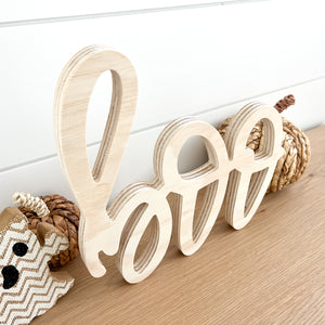 Hand-lettered "boo" wood sign in natural