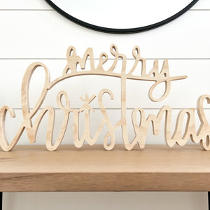 Hand-lettered "merry christmas" wood sign