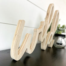 Load image into Gallery viewer, Hand-lettered "wild" wood sign sitting on table