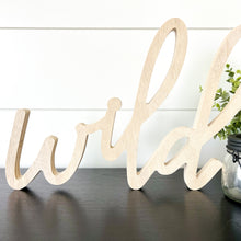 Load image into Gallery viewer, Hand-lettered "wild" wood sign sitting on table