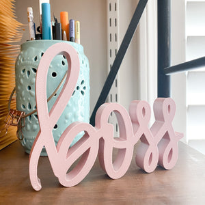 hand-lettered boss sign - decor piece shown in candy pink