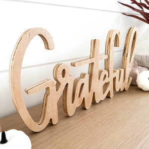 Hand-lettered "grateful" wood sign