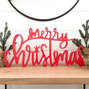 Hand-lettered "merry christmas" wood sign in red