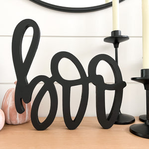 Hand-lettered "boo" wood sign in black
